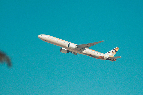 Airplane over coast and mountains